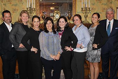 Dr. Arno H. Fried (right) and Dr. Frank Ciminello (left) flank the ANA staff.